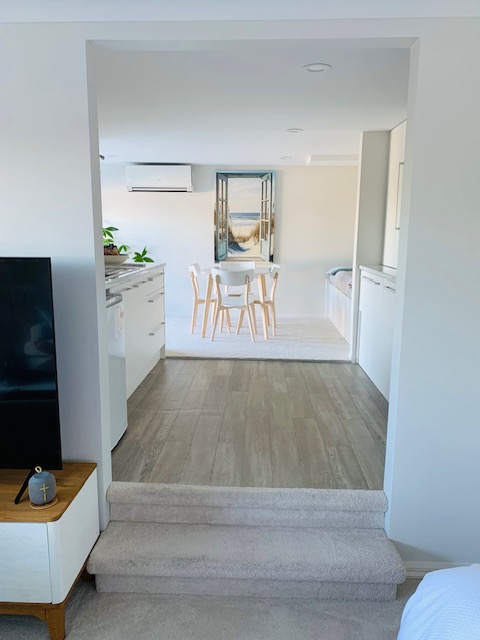 View through the studio toward the kitchenette and dining area.