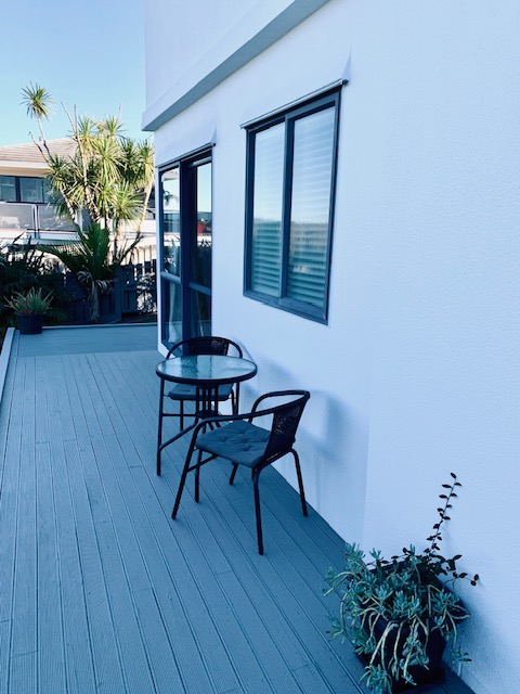 Outdoor deck seating beside the private studio.