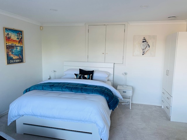 Queen bed inside CaliKiwis Studio.